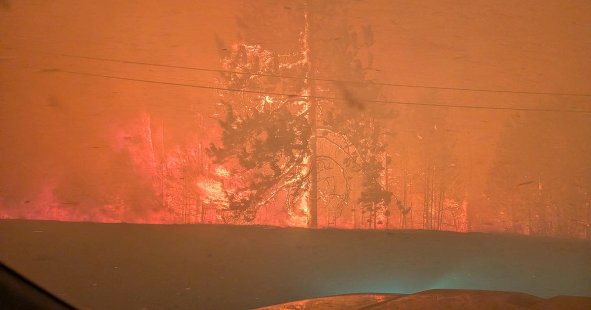 Fast-moving wildfire in western Canada forces more than 20,000 people to evacuate, killing at least 1